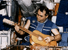 Cosmonaut playing guitar